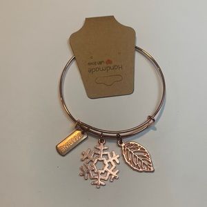 Handmade rose gold stainless steel bracelet with 3 charms.
